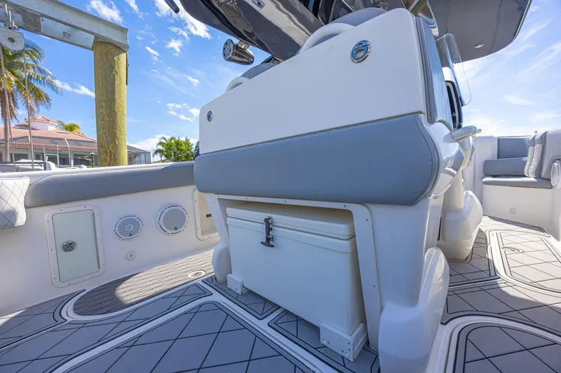 Slide: The Image of 2010 Concept 4400 Sport Yacht interior with seating and storage, under a clear blue sky. - 57