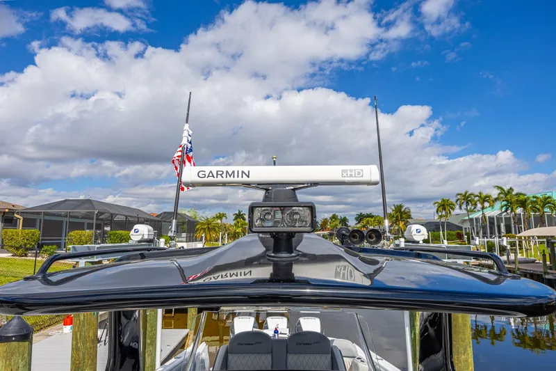Slide: The Image of 2010 Concept 4400 Sport Yacht with Garmin radar, docked under a blue sky. - 69
