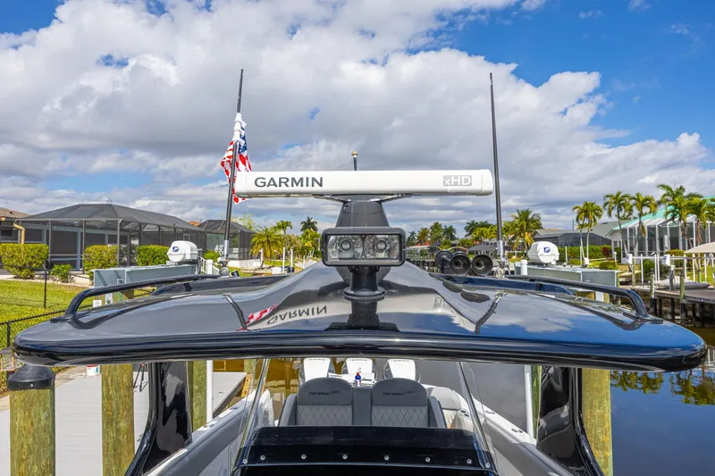 Slide: The Image of 2010 Concept 4400 Sport Yacht with Garmin radar, docked under a blue sky. - 70