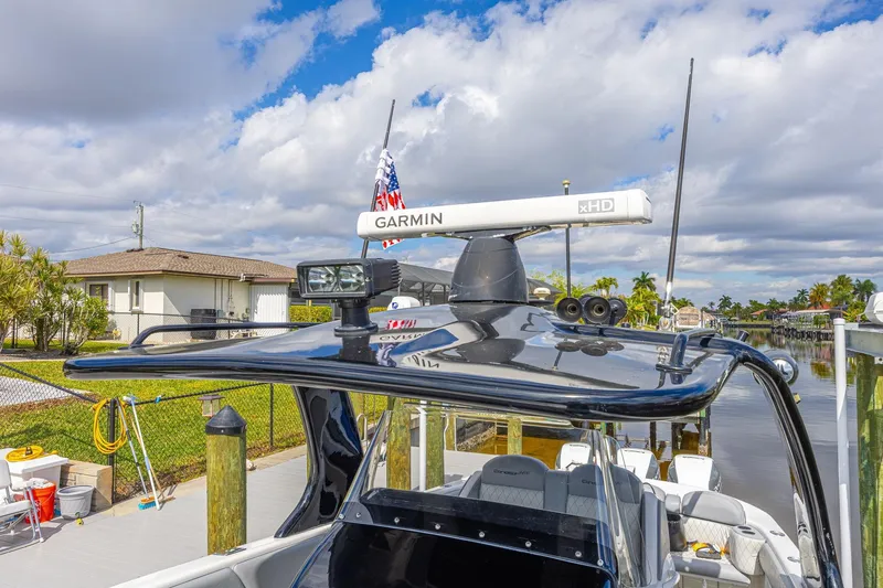 Slide: The Image of 2010 Concept 4400 Sport Yacht with Garmin radar, docked under a partly cloudy sky. - 71