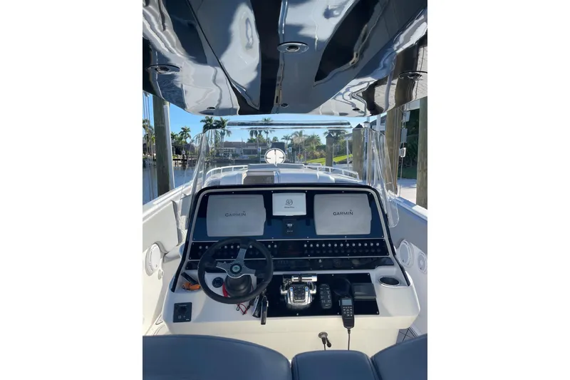 Slide: The Image of 2010 Concept 4400 Sport Yacht cruising on calm waters under a clear blue sky. - 8