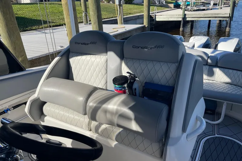 Slide: The Image of 2010 Concept 4400 Sport Yacht cruising on open water, featuring triple outboard engines. - 9