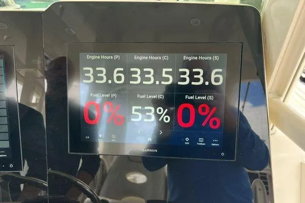 Slide: The Image of Display screen on 2018 Hydra-Sports 3000 CC showing engine hours and fuel levels. - 19