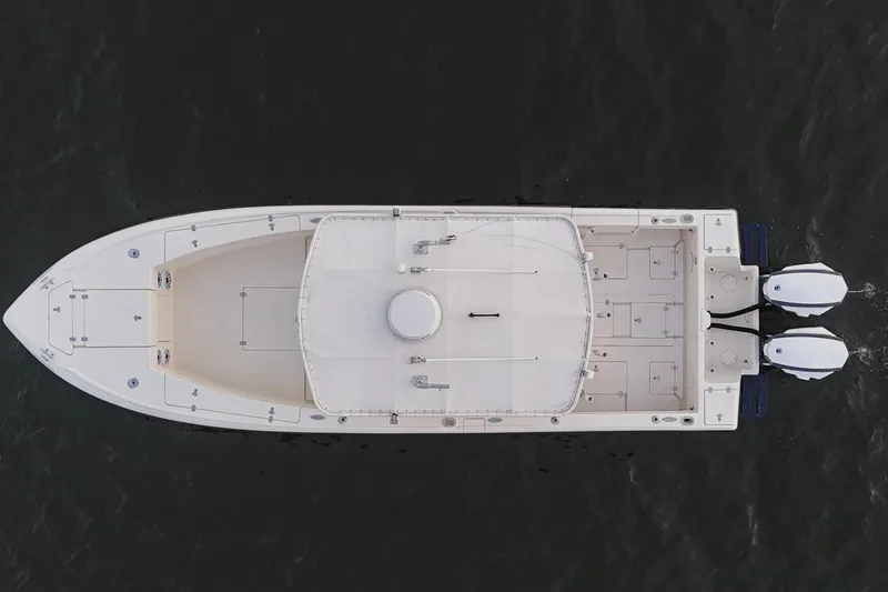 Slide: The Image of Overhead view of a 2003 Intrepid 289 Center Console boat on water. - 17