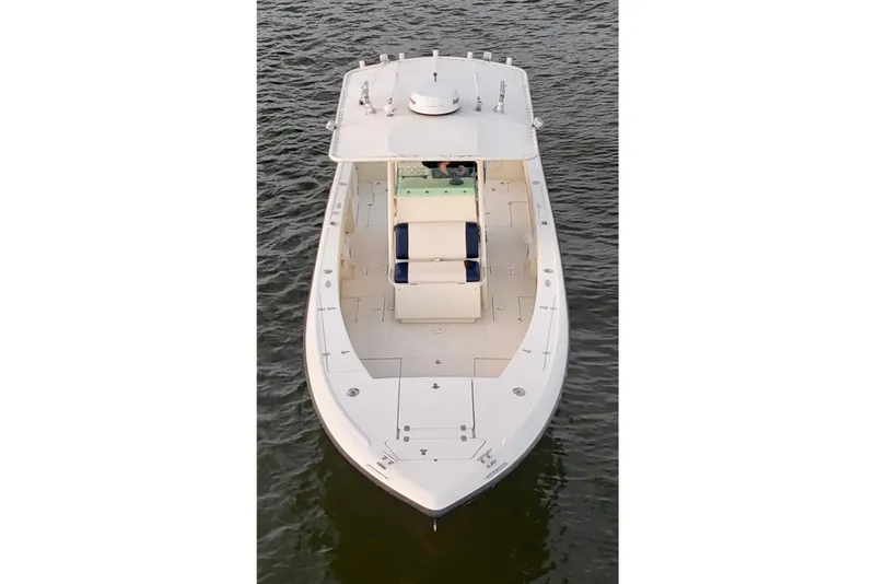 Slide: The Image of 2003 Intrepid 289 Center Console boat on water, aerial view. - 23