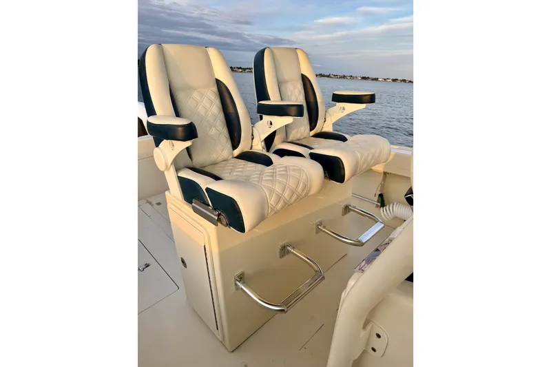 Slide: The Image of 2003 Intrepid 289 Center Console boat seats with ocean view. - 46