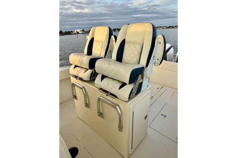 Slide: The Image of Intrepid 289 Center Console 2003 boat seats on the water. - 47