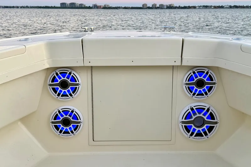 Slide: The Image of 2003 Intrepid 289 Center Console boat with blue LED speakers on deck. - 56