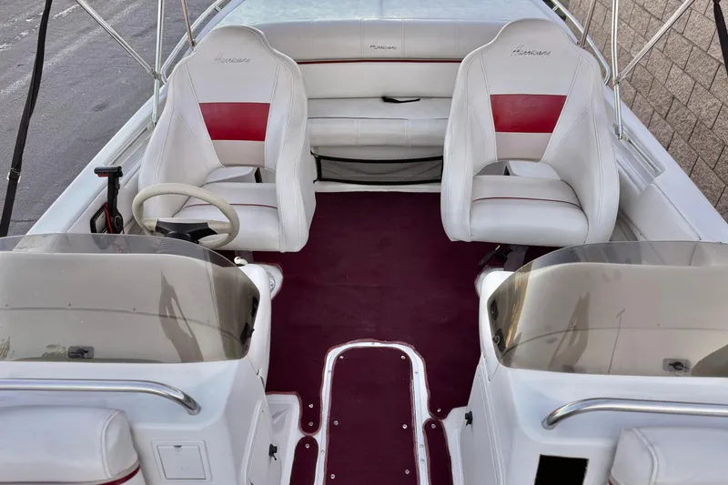 Slide: The Image of 2000 Godfrey Hurricane 2100 Sundeck interior with white and red seating. - 11