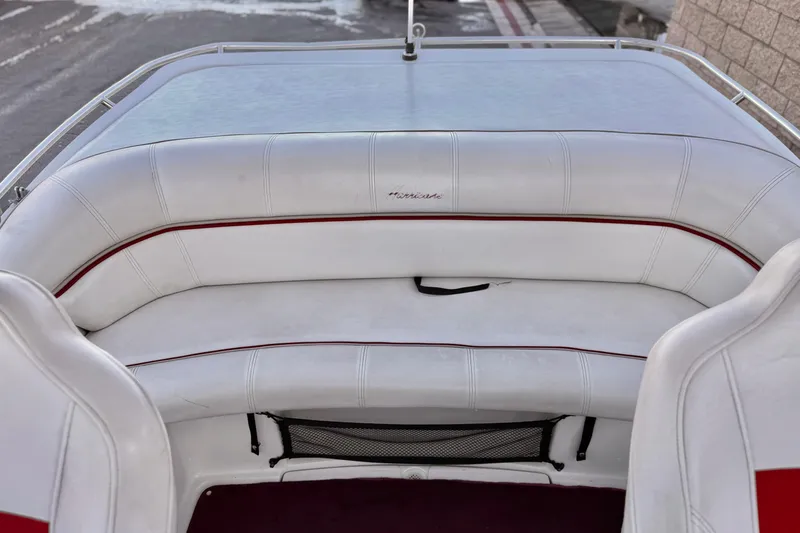 Slide: The Image of 2000 Godfrey Hurricane 2100 Sundeck boat interior with white and red seating. - 12