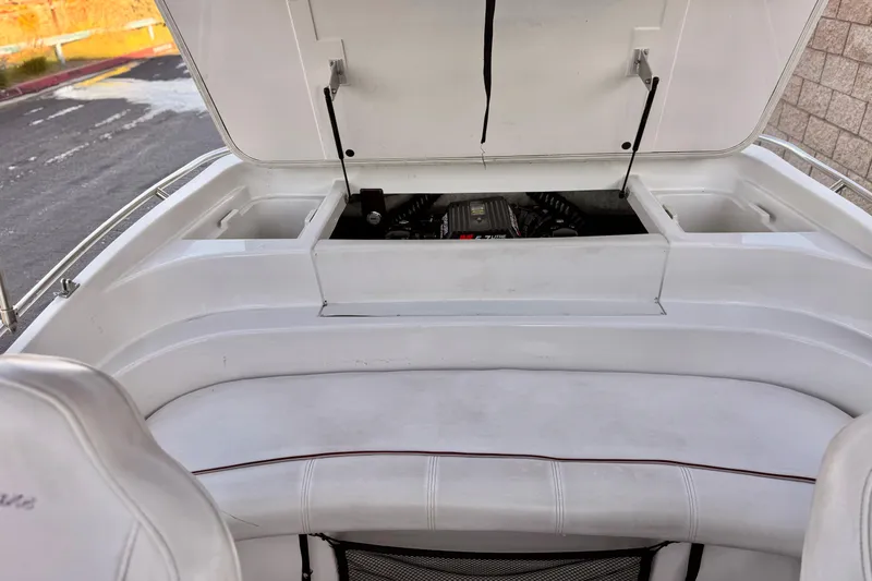 Slide: The Image of 2000 Godfrey Hurricane 2100 Sundeck boat engine compartment with open hatch. - 13