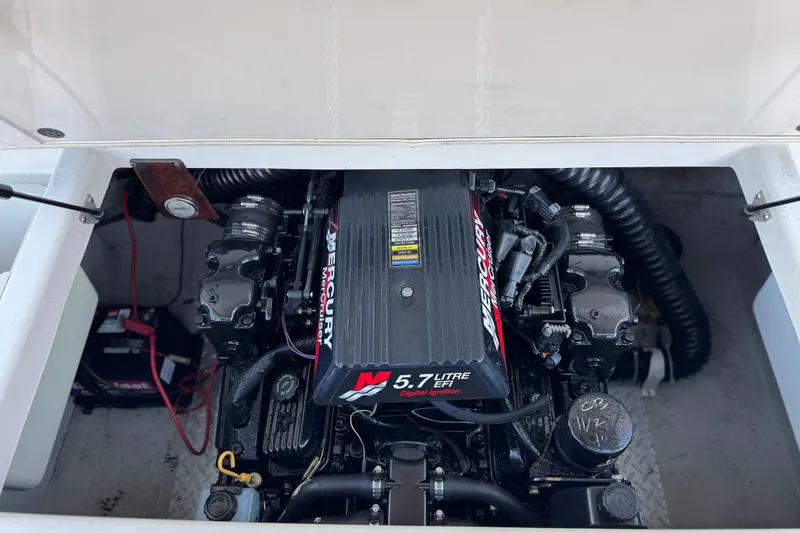 Slide: The Image of Engine compartment of a 2000 Godfrey Hurricane 2100 Sundeck with Mercury 5.7L EFI engine. - 14