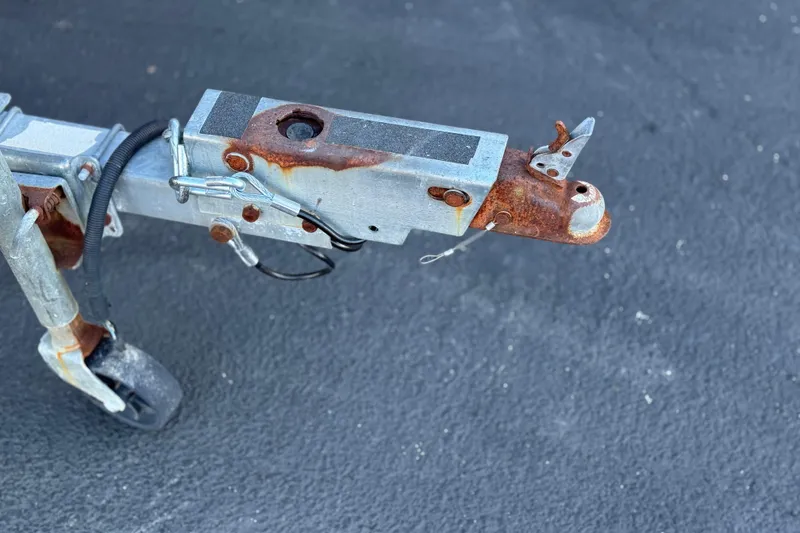 Slide: The Image of Trailer hitch with rust on a 2000 Godfrey Hurricane 2100 Sundeck boat trailer. - 22