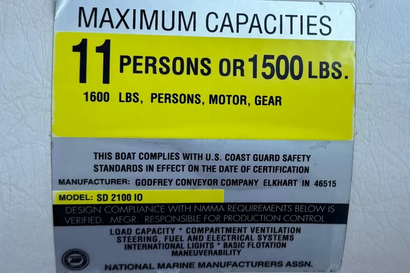 Slide: The Image of Maximum capacity label for 2000 Godfrey Hurricane 2100 Sundeck, 11 persons or 1500 lbs. - 23