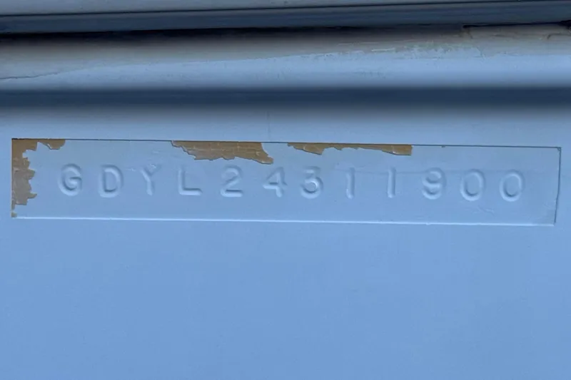 Slide: The Image of Hull identification number on a 2000 Godfrey Hurricane 2100 Sundeck boat. - 24
