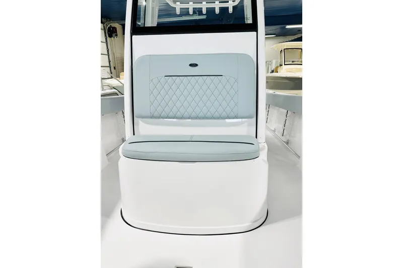 Slide: The Image of 2026 Sportsman Open 232 Center Console boat interior with cushioned seating and sleek design. - 11