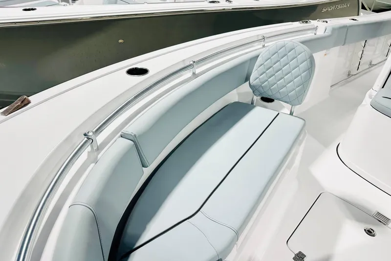 Slide: The Image of 2026 Sportsman Open 232 Center Console boat interior with cushioned seating and sleek design. - 9
