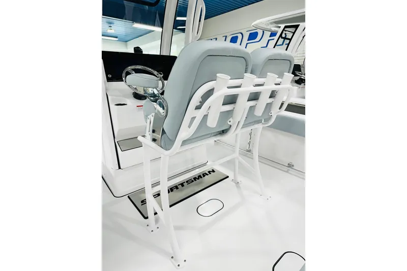 Slide: The Image of 2026 Sportsman Open 232 Center Console boat interior with dual seats and rod holders. - 6