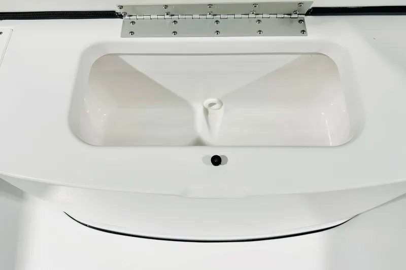Slide: The Image of 2026 Sportsman Open 232 Center Console livewell, featuring a sleek white design. - 12