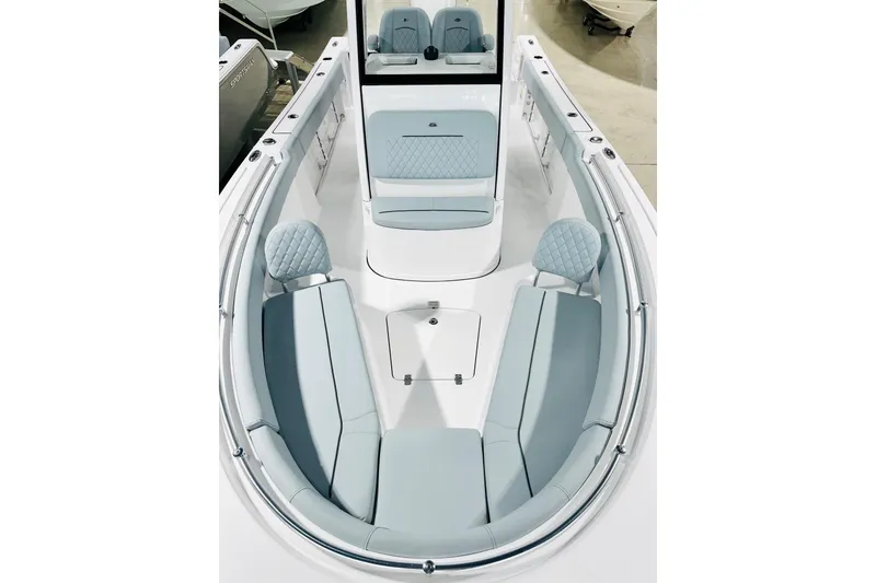 Slide: The Image of 2026 Sportsman Open 232 Center Console boat interior with cushioned seating and sleek design. - 10