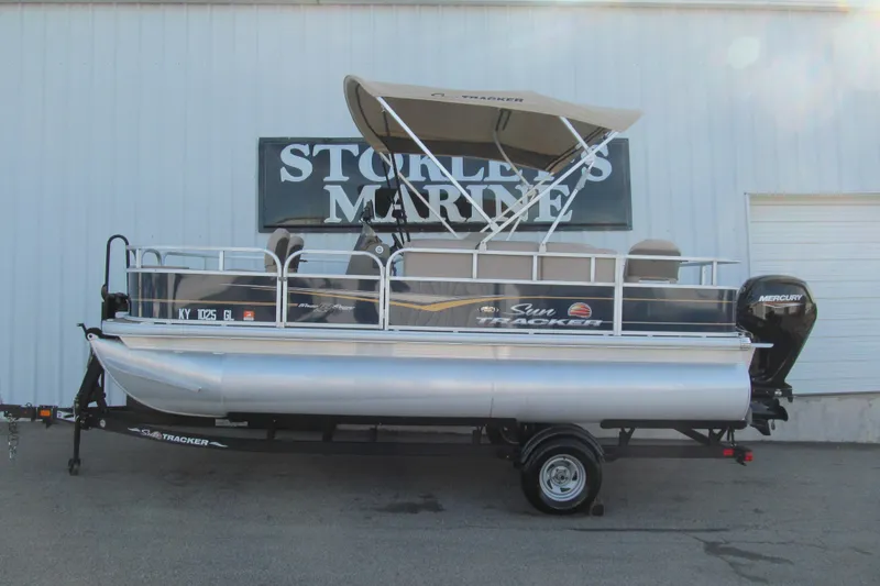 The Image of 2024 Sun Tracker Bass Buggy 18 DLX pontoon boat with Mercury engine at dealership. - 0