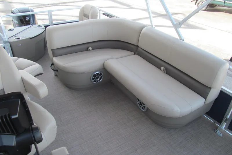 Slide: The Image of 2024 Sun Tracker Bass Buggy 18 DLX pontoon boat with beige seating and modern interior design. - 11