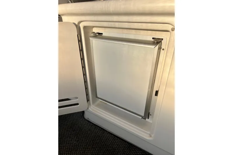 Slide: The Image of 1997 Sea Ray 370 Aft Cabin interior fridge compartment with open door. - 18