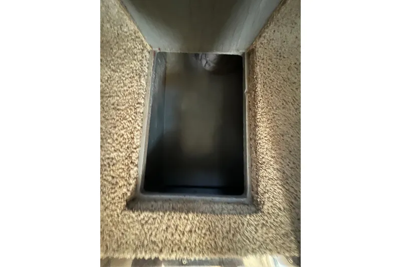 Slide: The Image of Carpeted interior compartment of a 1997 Sea Ray 370 Aft Cabin boat. - 54