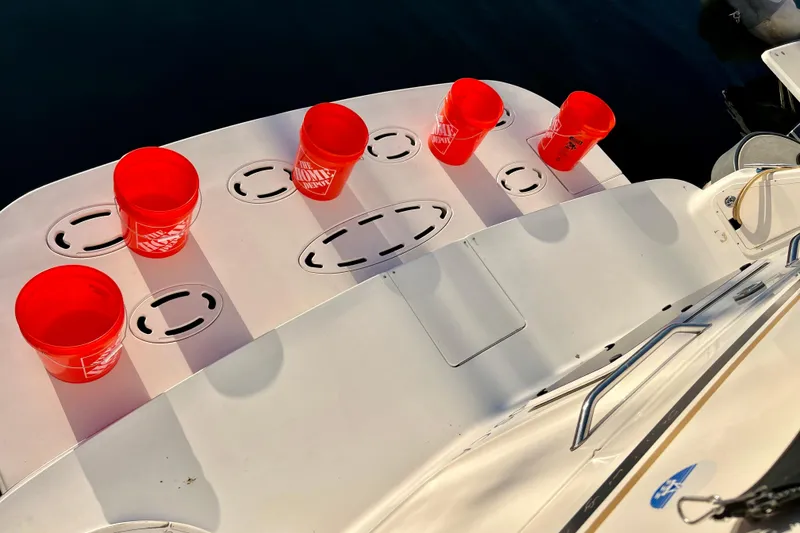 Slide: The Image of 1997 Sea Ray 370 Aft Cabin with red buckets on deck. - 8