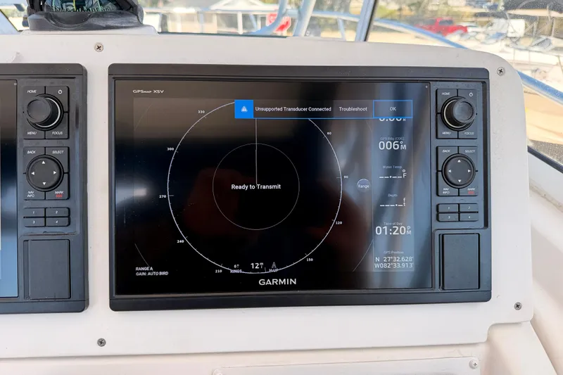 Slide: The Image of Garmin GPS display on 2007 Pro-Line 32 Express boat, showing navigation and radar interface. - 14
