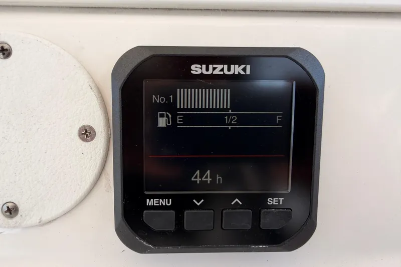 Slide: The Image of Suzuki fuel gauge display on 2007 Pro-Line 32 Express boat, showing 44 hours. - 16