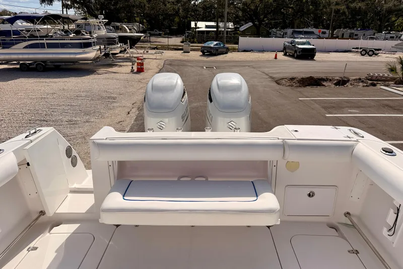 Slide: The Image of 2007 Pro-Line 32 Express boat with dual Suzuki outboard motors in a marina setting. - 21