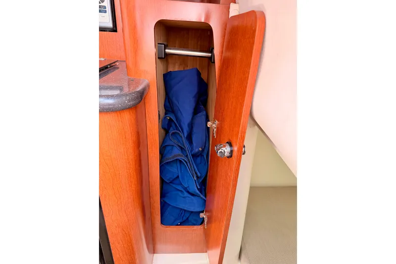 Slide: The Image of 2007 Pro-Line 32 Express cabin storage with blue fabric inside. - 34