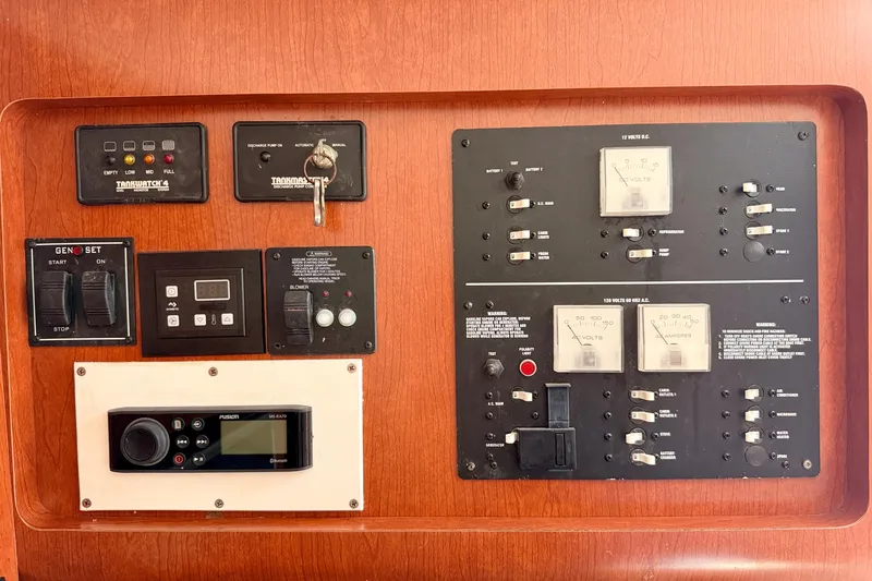 Slide: The Image of Control panel of a 2007 Pro-Line 32 Express boat with various switches and gauges. - 35