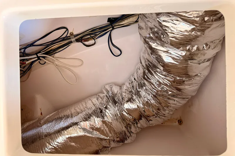 Slide: The Image of 2007 Pro-Line 32 Express boat wiring and ductwork in compartment. - 36