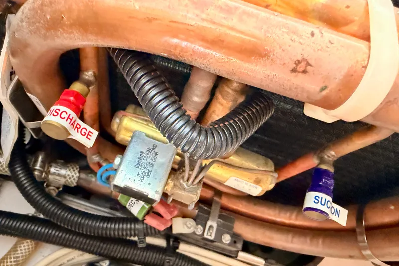 Slide: The Image of Engine compartment of 2007 Pro-Line 32 Express boat showing discharge and suction valves. - 39