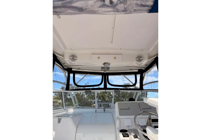 Slide: The Image of 2007 Pro-Line 32 Express boat interior with Garmin navigation system and clear canopy. - 43