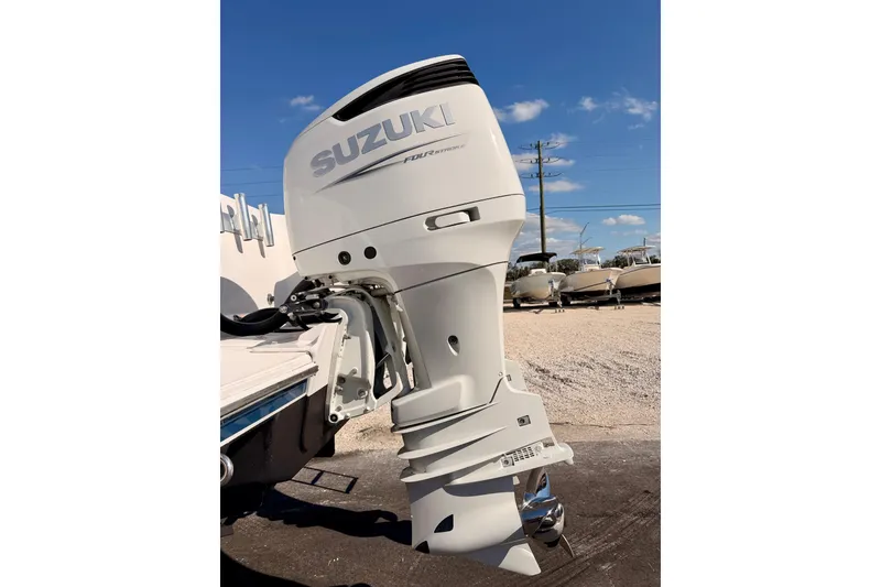 Slide: The Image of 2007 Pro-Line 32 Express with Suzuki outboard motor in a sunny outdoor setting. - 44