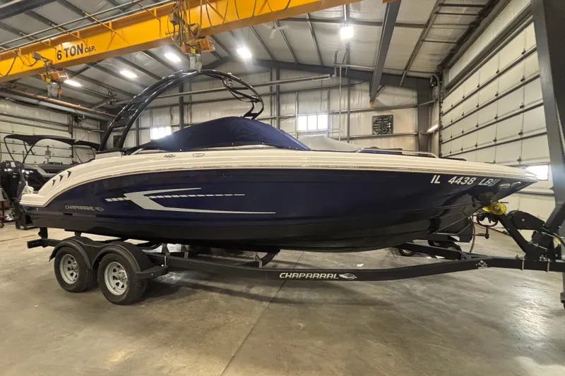 Slide: The Image of 2021 Chaparral 23 SSi boat on trailer in indoor storage facility. - 3
