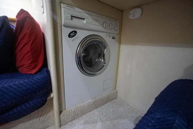 Slide: The Image of Compact washing machine in 2003 Riviera 4700 Sport Yacht interior. - 37