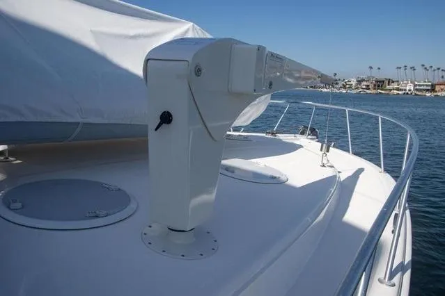 Slide: The Image of 2003 Riviera 4700 Sport Yacht deck with ocean view and clear blue sky. - 19