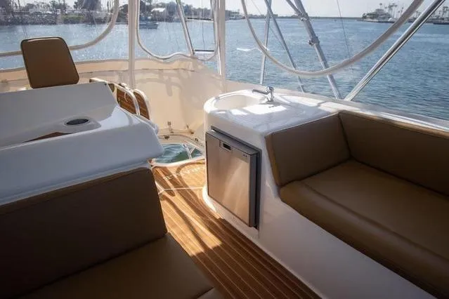 Slide: The Image of Interior of 2003 Riviera 4700 Sport Yacht with seating and ocean view. - 22