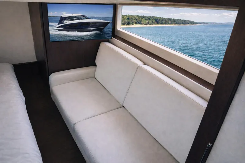 Slide: The Image of Interior of 2019 Regal 42 Grande Coupe yacht with sofa and scenic window view. - 19