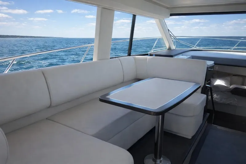 Slide: The Image of Luxurious interior of 2019 Regal 42 Grande Coupe yacht with ocean view. - 8