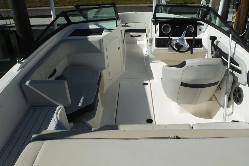 Slide: The Image of 2021 Sea Ray SPX 190 Outboard boat interior with seating and steering console. - 16