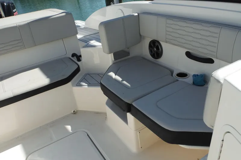 Slide: The Image of 2021 Sea Ray SPX 190 Outboard boat interior with gray seating and cup holder. - 20