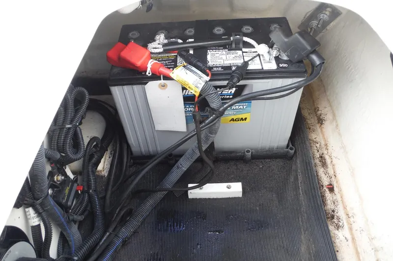 Slide: The Image of Battery compartment of a 2021 Sea Ray SPX 190 Outboard boat with AGM battery. - 29