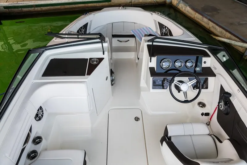 Slide: The Image of Manufacturer Provided Image: 2021 Sea Ray SPX 190 OB boat interior with steering wheel and seating. - 4