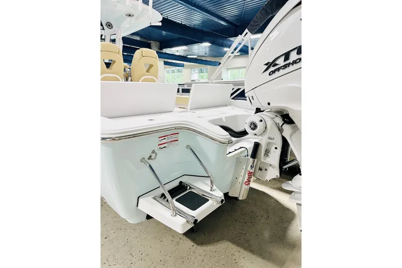 Slide: The Image of 2026 Sportsman Masters 267 Bay Boat with outboard motor and swim platform. - 13