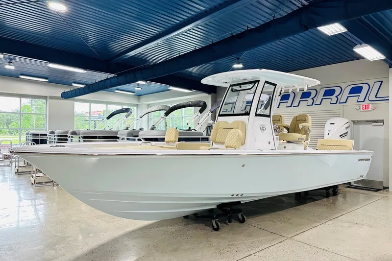 The Image of 2026 Sportsman Masters 267 Bay Boat displayed in a showroom with modern interior. - 2